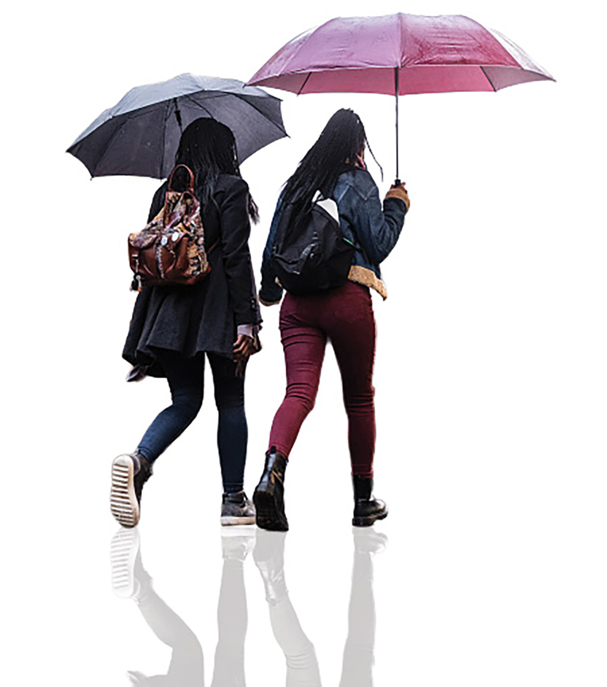 two young women walk with umbrellas on a wet street