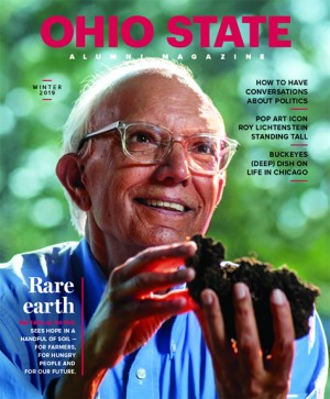 The Winter 2019 cover of Ohio State Alumni Magazine shows Ratan Lal, an older Indian man who, as an Ohio State professor, has made a significant impact on the study of climate change. Wearing glasses and a smile, he hold a chunk of farm soil. Light shining from behind him makes him seem glowing.