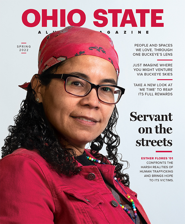 Esther FLores in a red bandana and red jacket portrait on the cover of the Alumni Magazine Spring 22 issue
