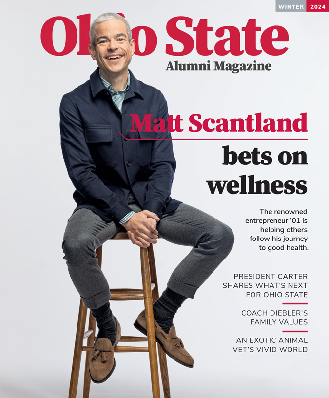 On the cover of the winter 2024 edition of Ohio State Alumni Magazine, renowned tech entrepreneur Matt Scantland perches on a stool looking relaxed, casual and happy. His smile is big and so genuine, his cheeks and the skin around his eyes crinkle. He’s a good looking, thin white man with white hair and blue eyes that match his buttoned-up jacket. He also wears dress p ants, a striped button down and his socks, coat and eyes all look to be the same shade of blue.