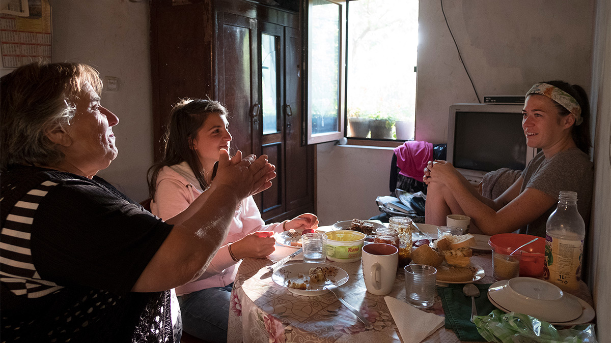 Craycraft, right, and her residency roommate, Nelina, visit with Todorova over breakfast.