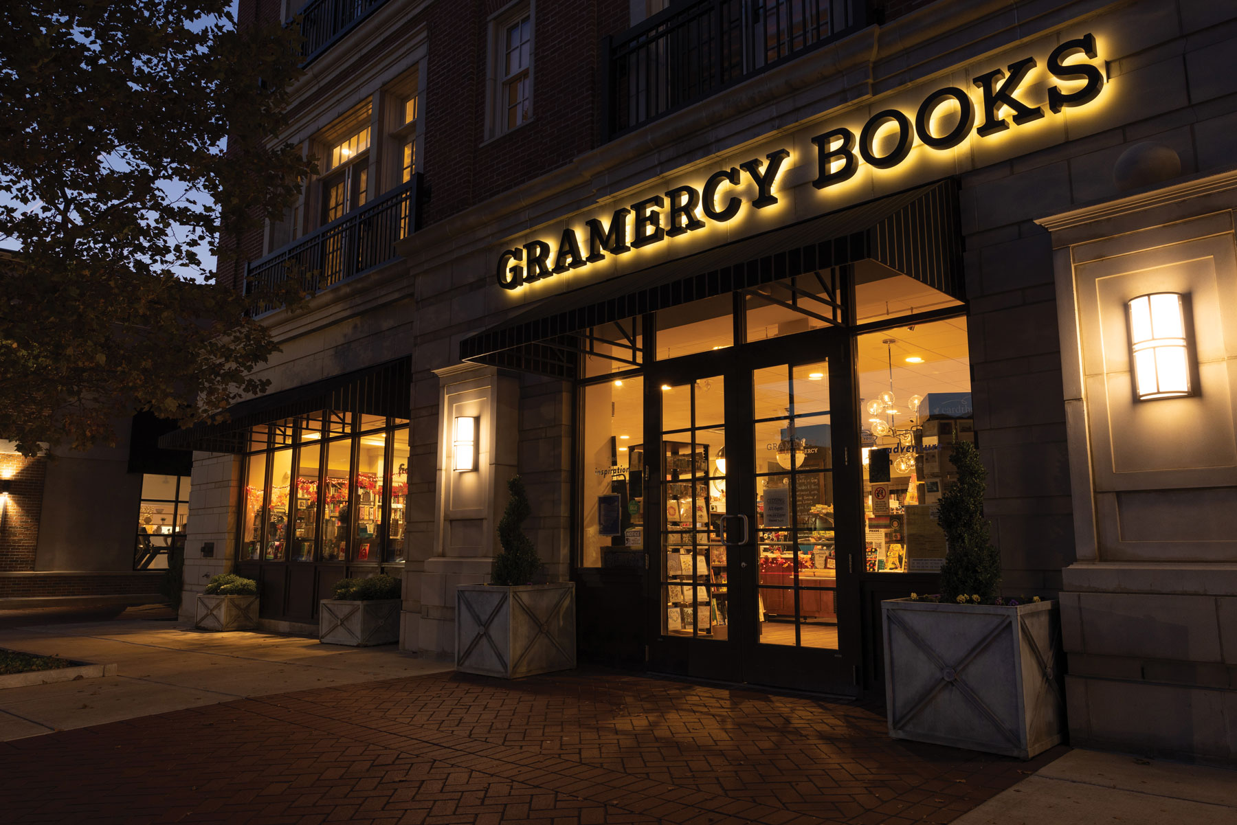 As dusk sets in, the Gramercy Books storefront is awash in a glowing, welcoming light beckoning shoppers inside.