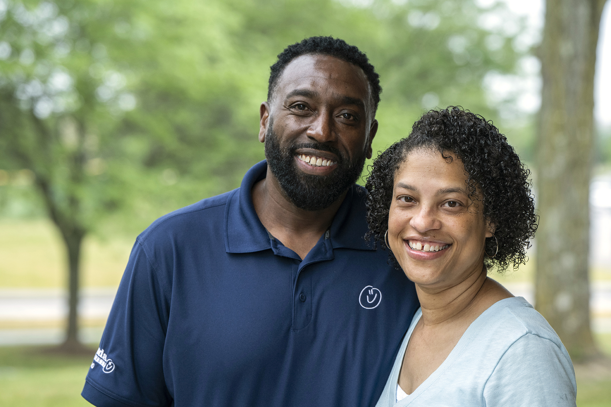 The Poindexters pose for a photo. They’re both good looking—Amber in a naturally pretty way. She has curly hair just past her ears and a cute gap-toothed smile. Alvin has short curly hair, a neatly trimmed beard and crinkles around his eyes that show his smile is genuine.