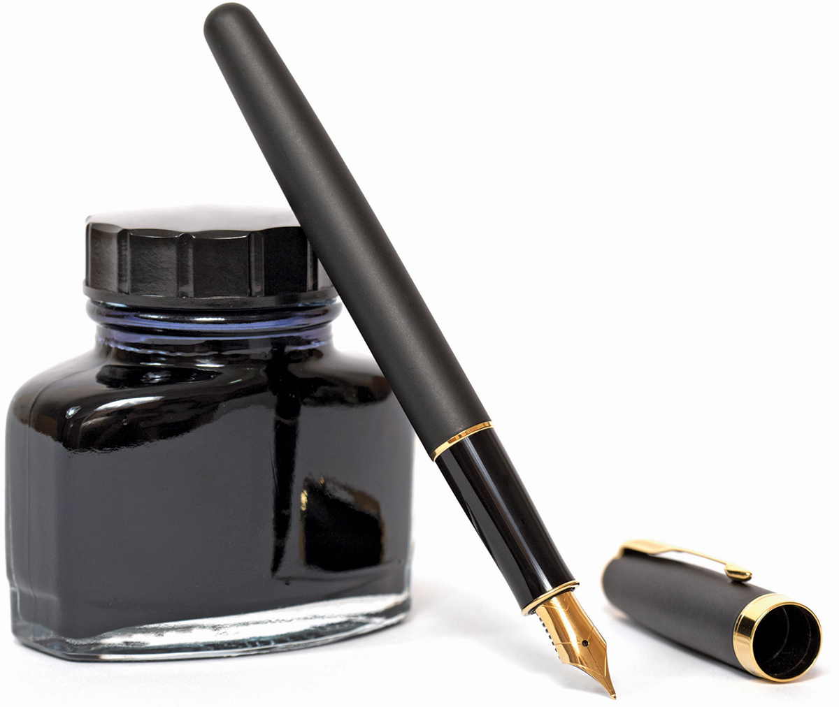 Classic fountain pen with bottle of black ink