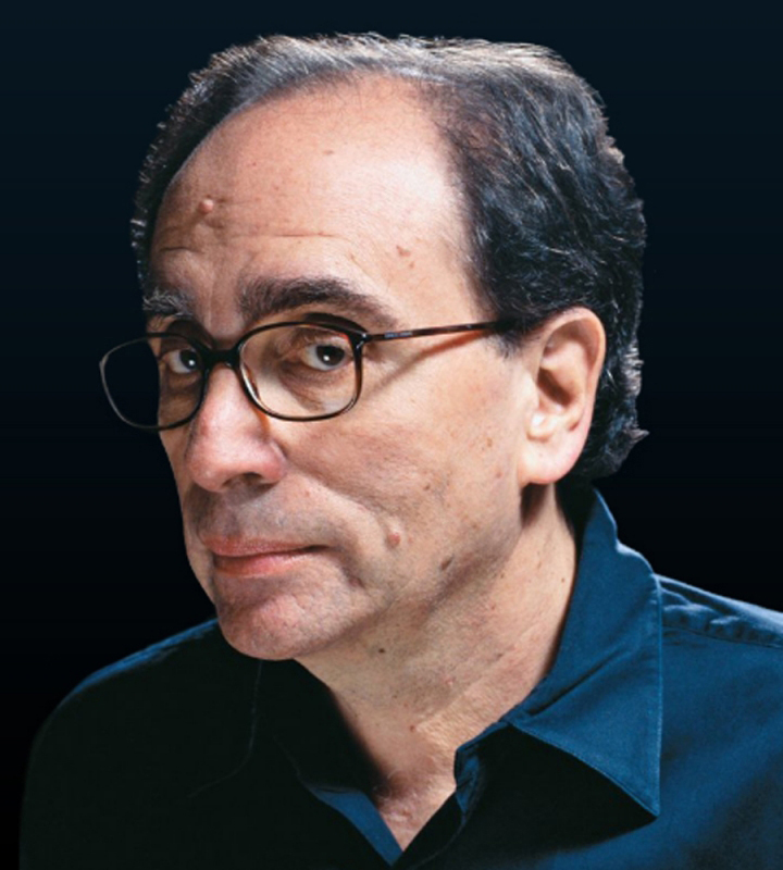 Author R.L. Stine, a white man with glasses, looks at the viewer as if he's contemplating writing a story that is scary, fun and thought-provoking.