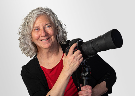 portrait of photographer Jo McCulty holding her camera