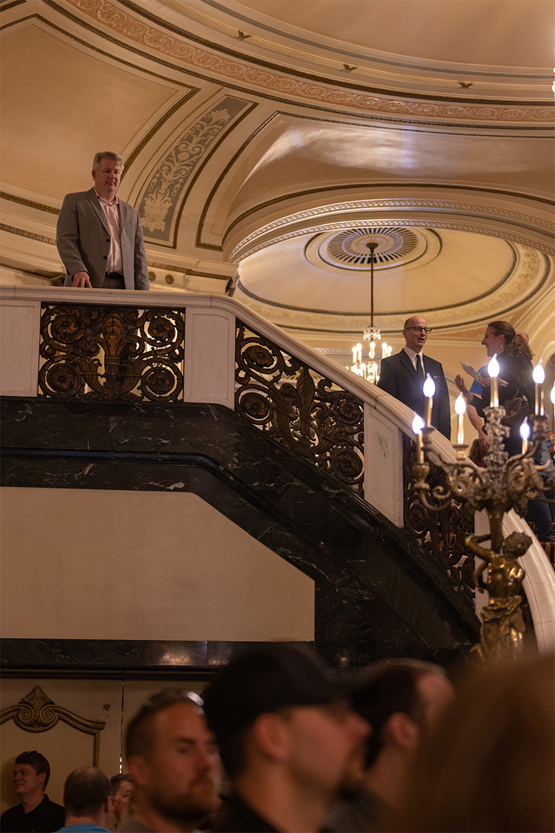 Whittington perched alone in the upper level of the lobby overseeing ticketholders entrance for the evening show