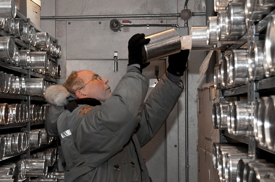 a man putting the ice core samples in a refrigerated facility in Columbus, Ohio