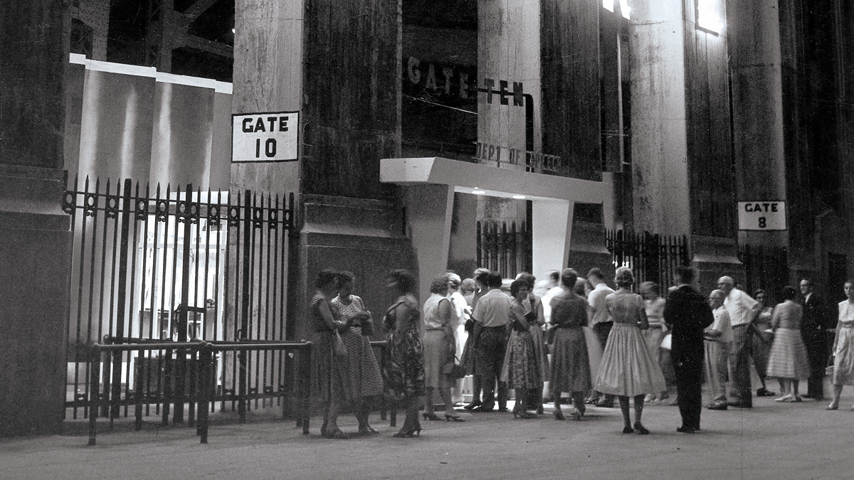 In an old black and white photo, people line up to enter the special entrance of a theatre built on B-Deck of Ohio Stadium