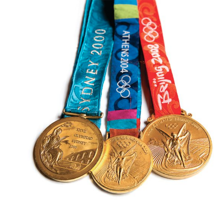 Katie Smith's gold Olympic medals all show winged goddesses and ribbons that say Sydney 2000, Athens 2004 and Beijing 2008