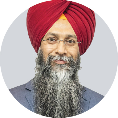 Guramrit Singh smiles for a portrait.