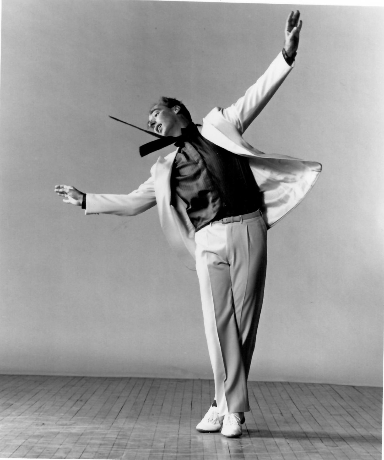 From the same dance, Strickler reaches his arms wide and leans backwards.