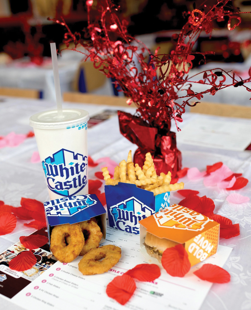 A White Castle meal sits next to a sparkly table decoration themed for Valentine's Day