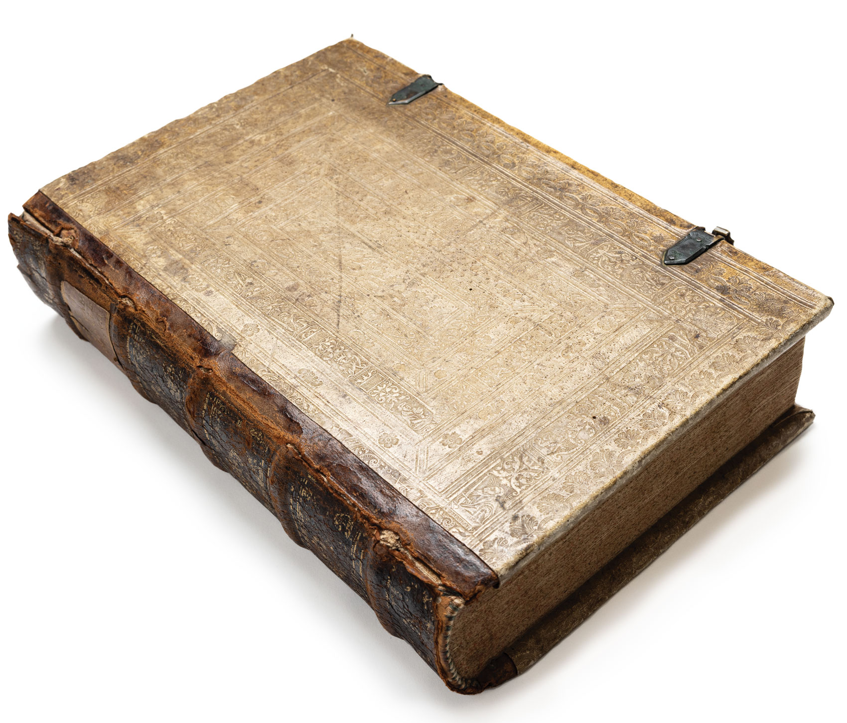 The closed book shows a worn leather exterior.