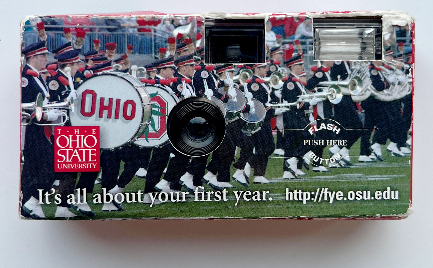 A disposable camera has an image of the Ohio State marching band on the front and the words "It's all about your first year."