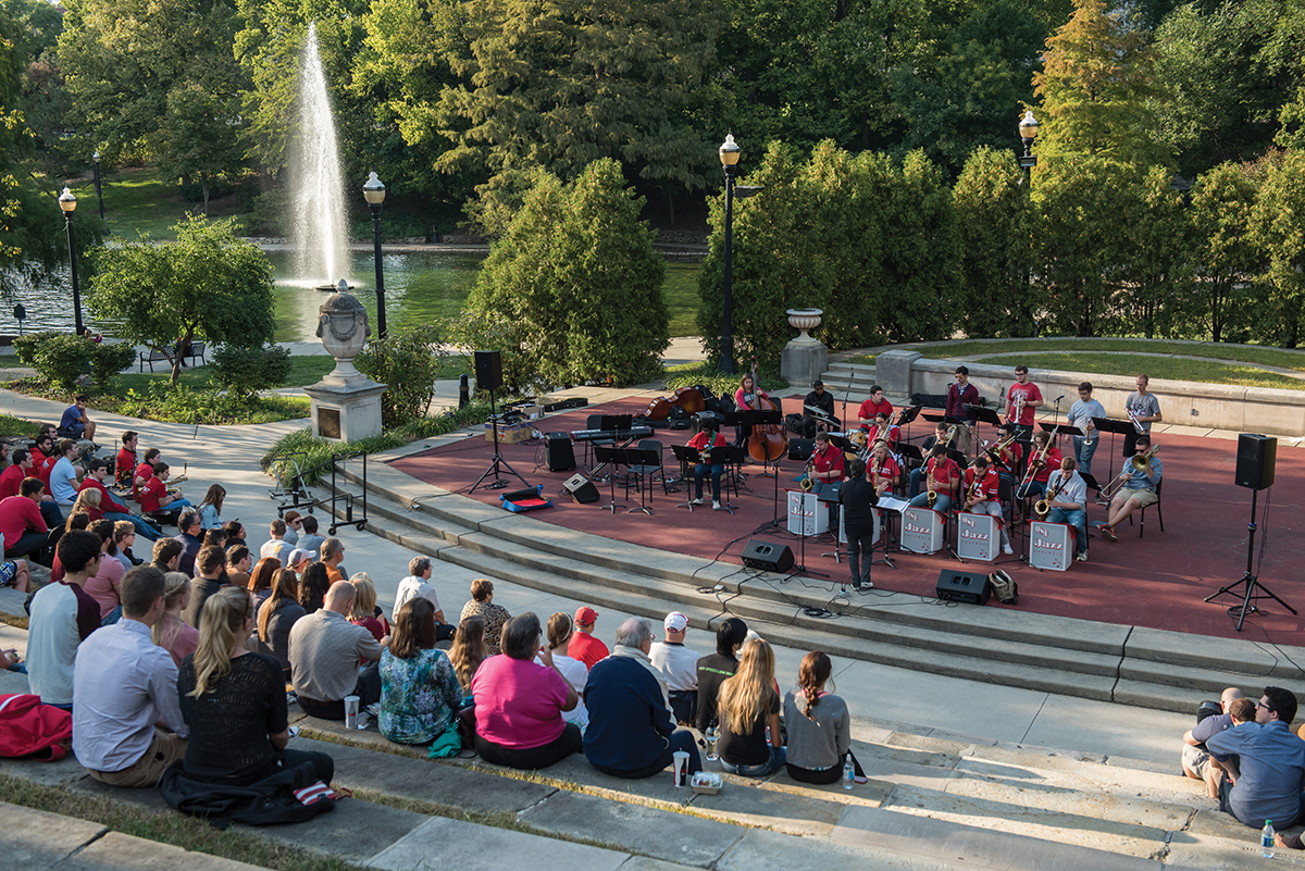 band members play at the browning amphitheater while spectators watch