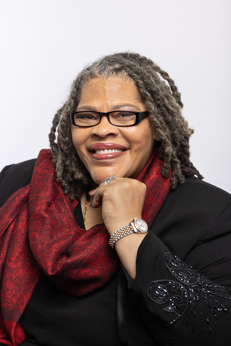 Patrice Palmer smiles with a hand to her chin as she poses for a photo in 2023.