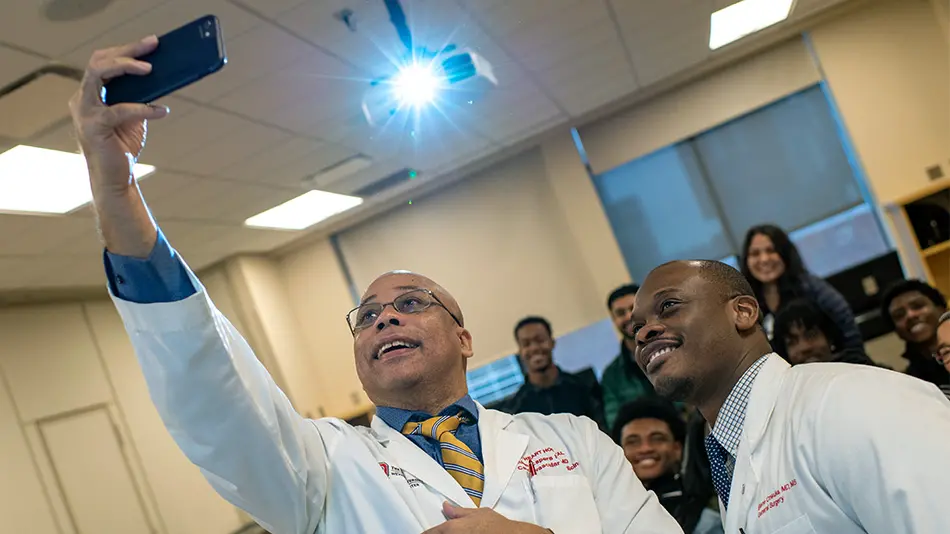 Doctor taking a selfie with medical students