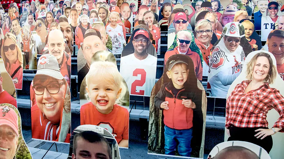 Rows of corrugated plastic cutouts depicting Ohio State football fans line the bleachers in Ohio Stadium.