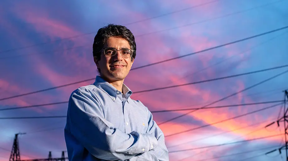 abdollah shafleezadeh standing in front of power lines