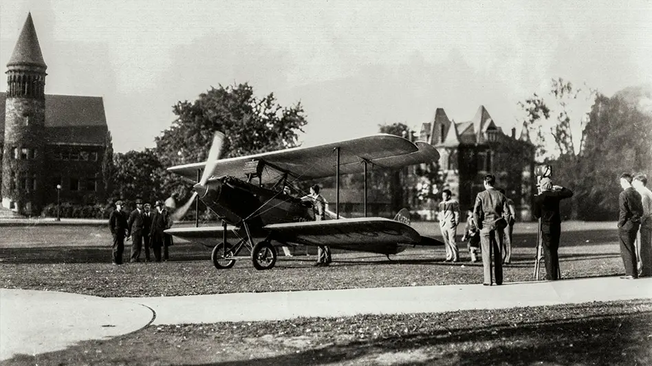 Black and white archival photo of a prop place landed on the Oval.