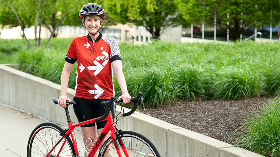 Woman standing next to bicycle