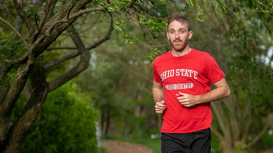 Man in red shirt running