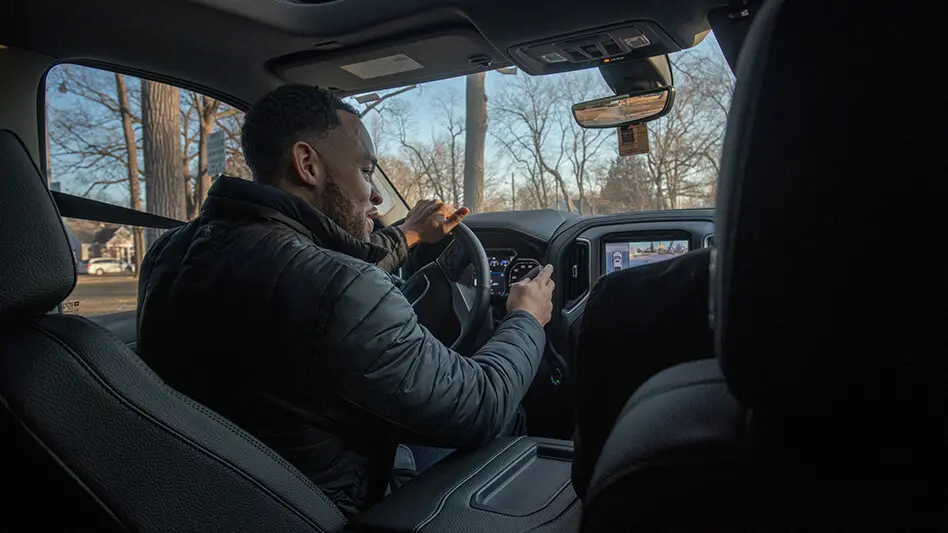 Charles Muse behind the wheel of his car