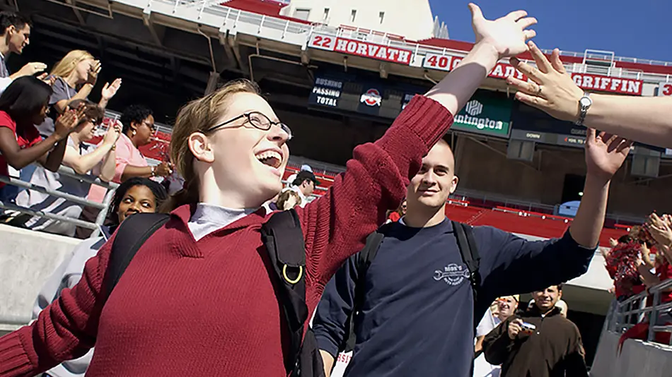 new students are welcomed with high-fives on the ramp at Ohio Stadium