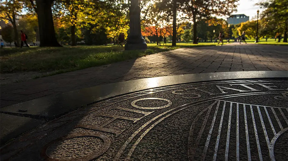 The Ohio State seal embedded in the walkway on the oval