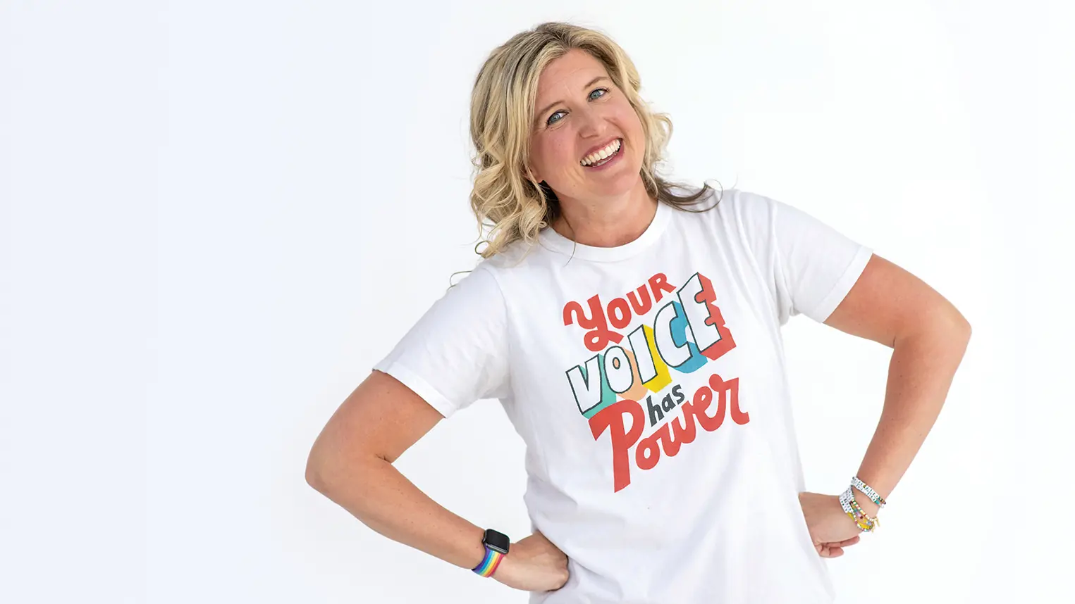 Katie Silcott wears a t-shirt reading "Your voice has power."