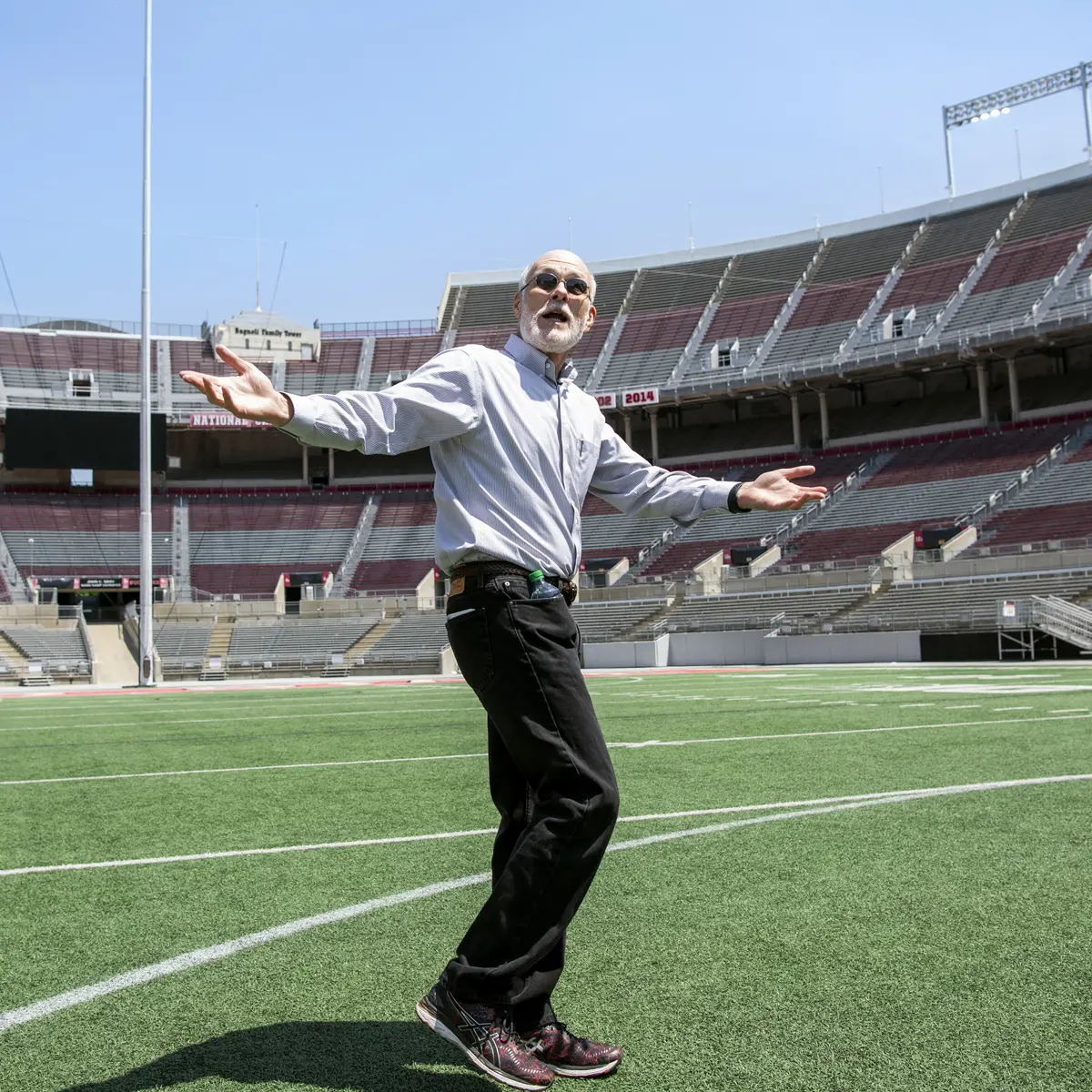 On a sunny day, an older man walking the football field turf of an empty Ohio Stadium spreads his arms wide to expound on a point about the awesomeness of its construction.