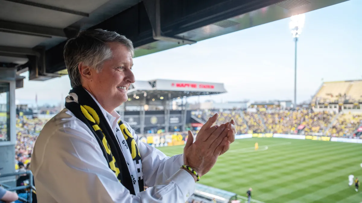 Dr. Pete Edwards cheers for Columbus Crew SC from his seat inside Mapfre Stadium