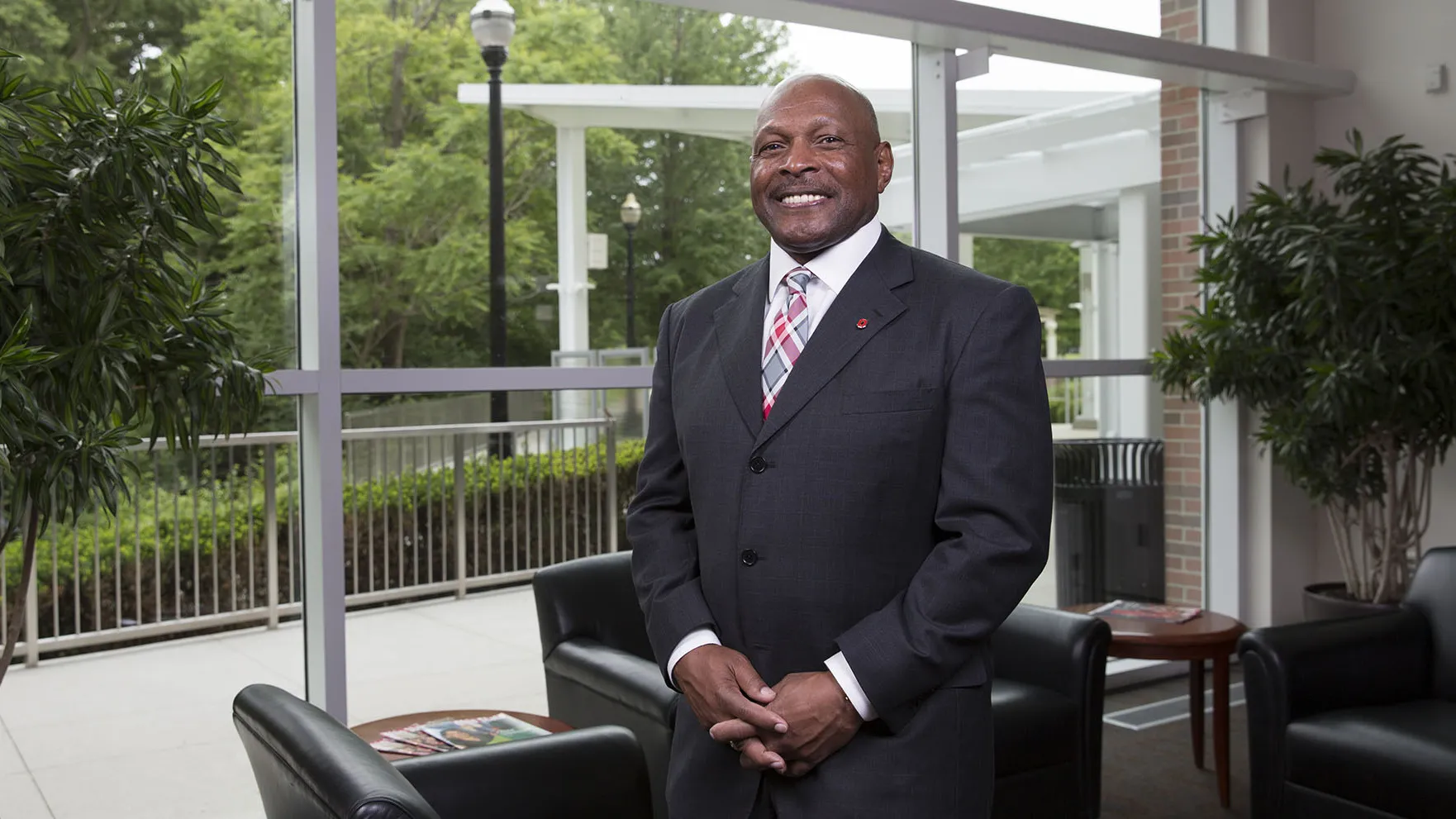 In the lobby of the Longaberger Alumni House, Archie Griffin stands straight with his hands loosely clasped in front of him. He wear a suit, a tie in Ohio State colors and a genuine smile. 