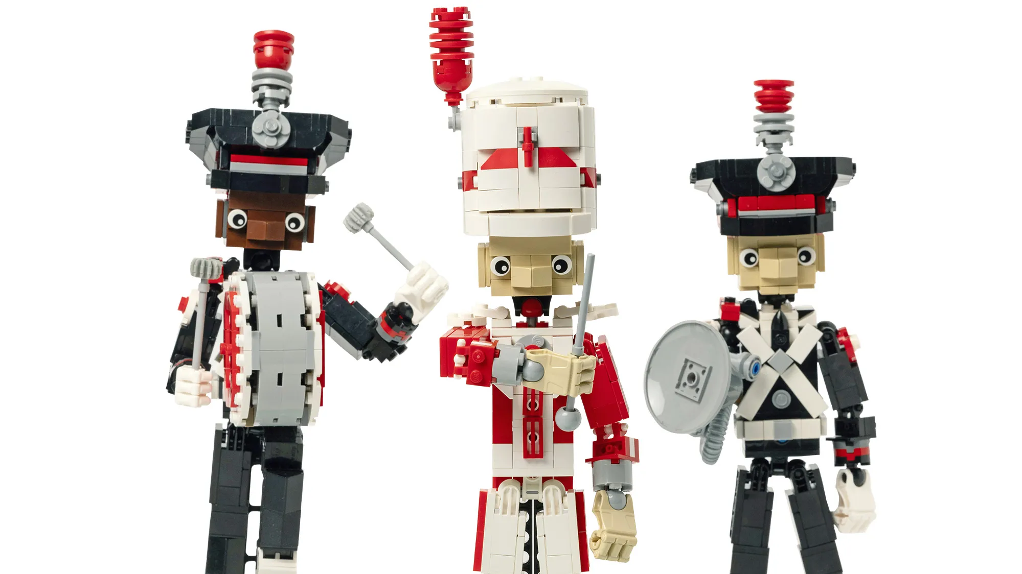 Three marching band members are built out of legos--a drum major, a bass drum player and a sousaphone player