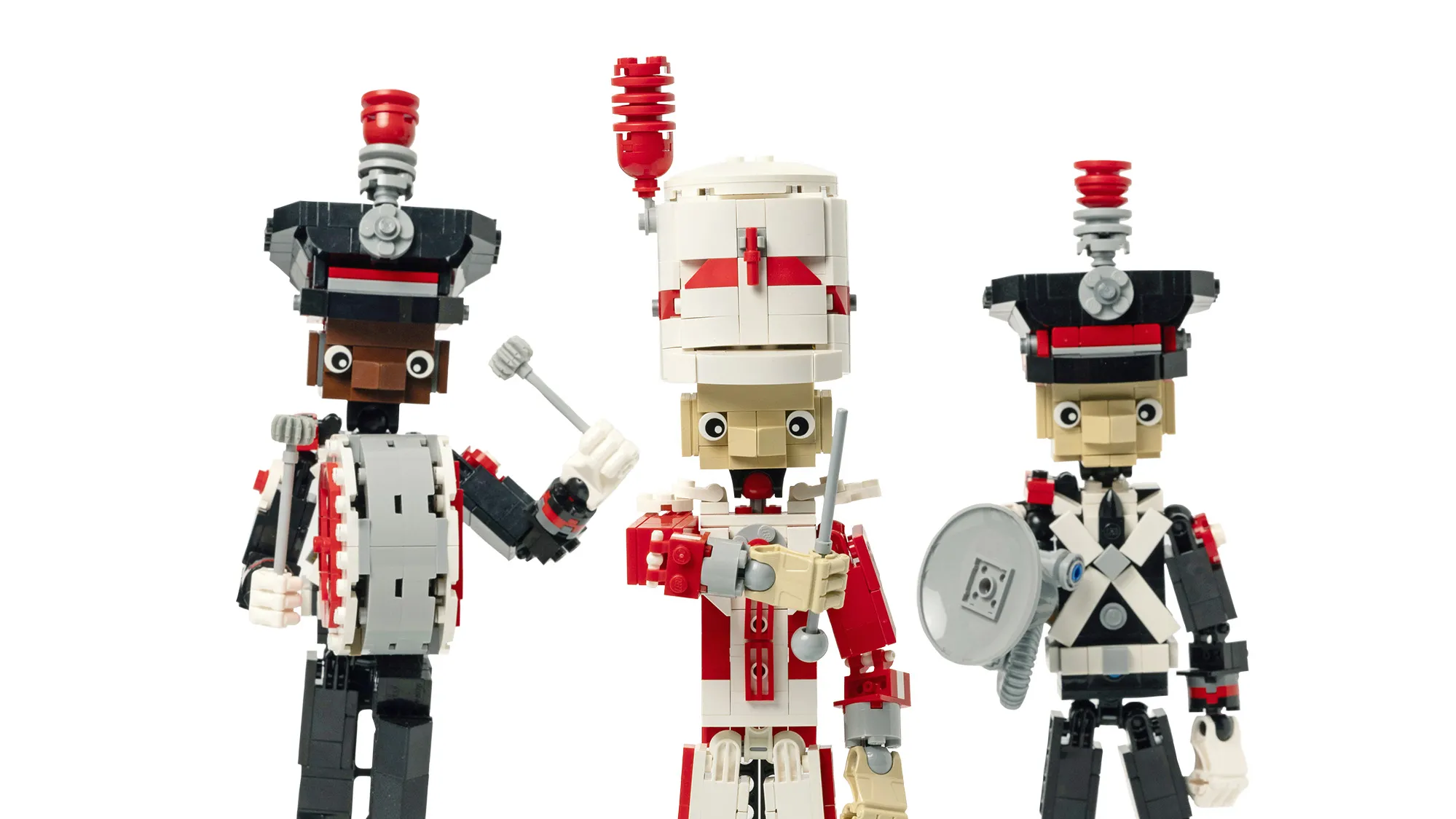 Three marching band members are built out of legos--a drum major, a bass drum player and a sousaphone player