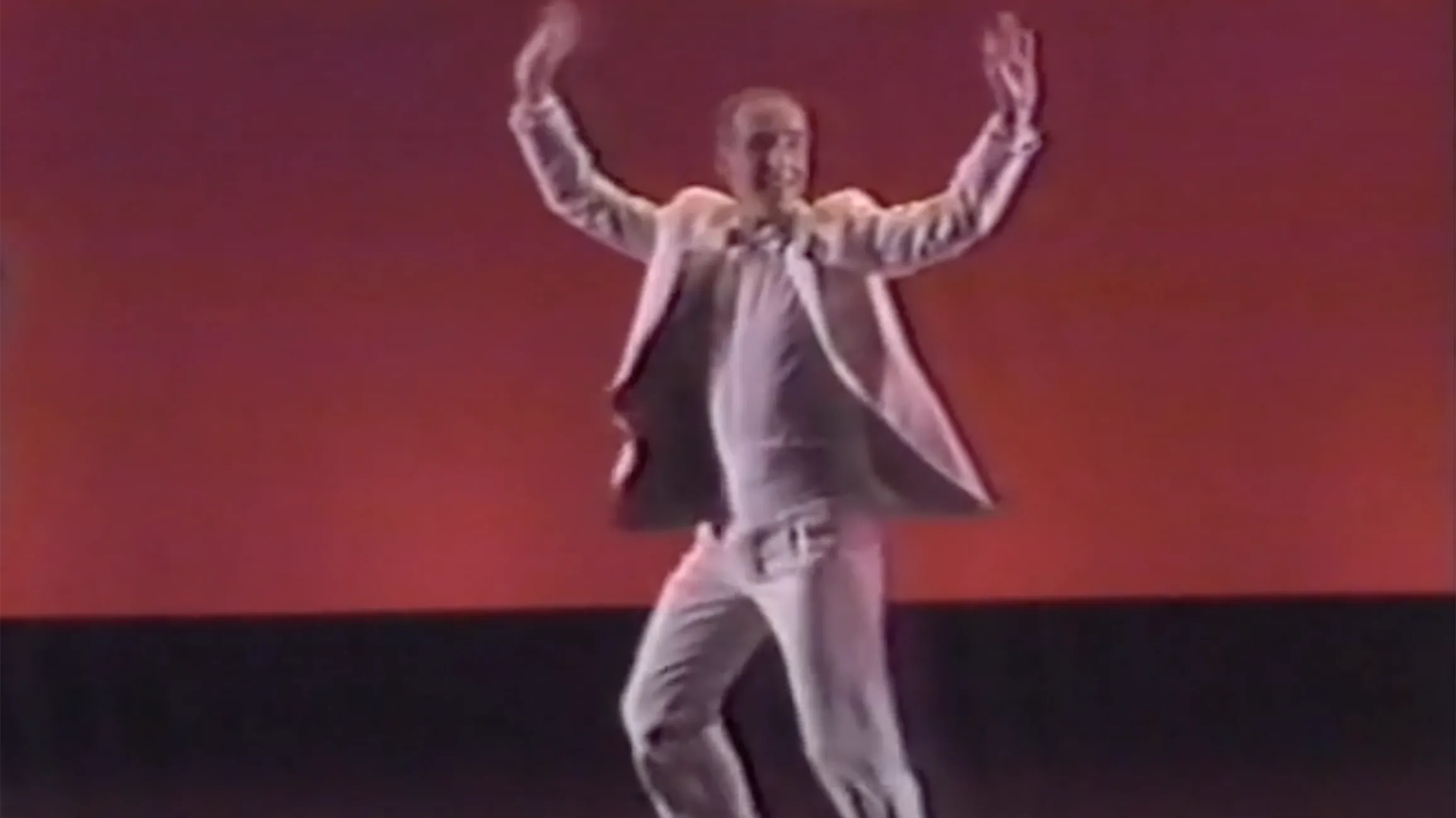 Strickler dances in a still from an old video