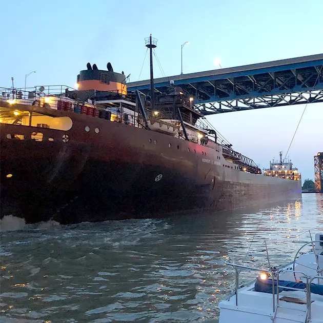 a barge going under a bridge near downtown Cleveland Ohio