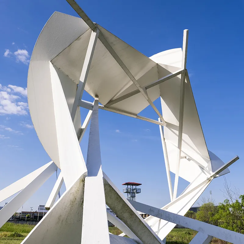 a white spiral sculpture is seen from the center