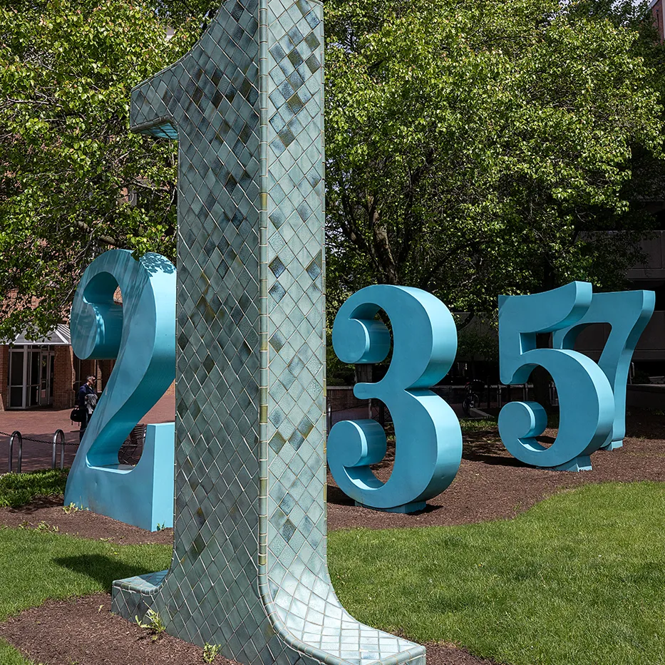 large 3-D numbers are interspersed throughout a small area
