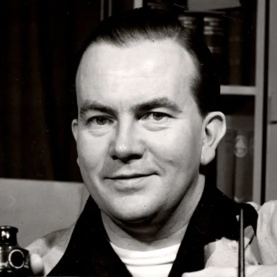 A portrait shows Milton Caniff slightly smiling