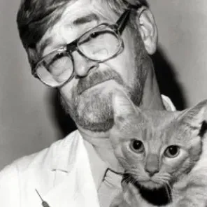 A portrait of Richard G. Olsen and a cat