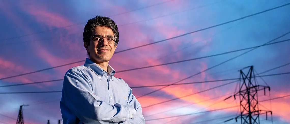 abdollah shafleezadeh standing in front of power lines