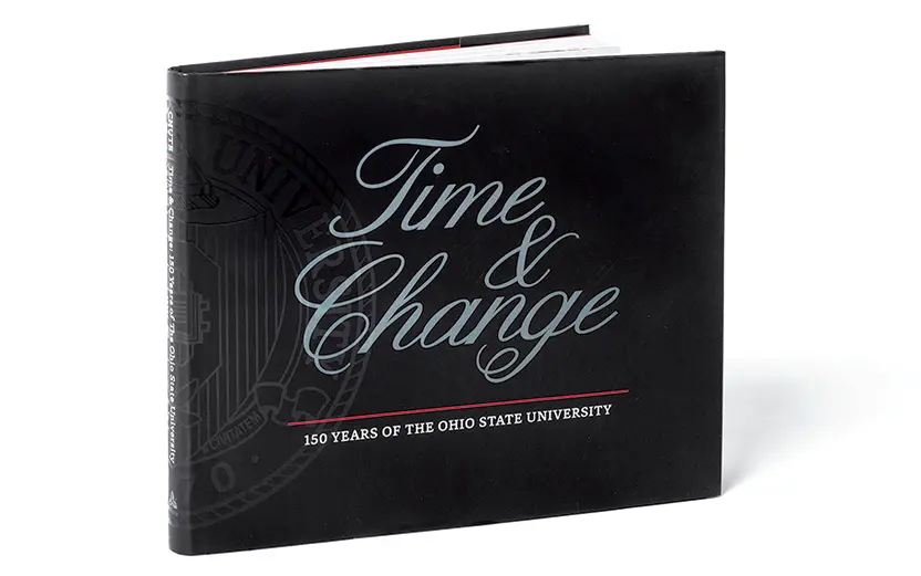 A book with a black cover that reads "Time & Change: 150 Years of The Ohio State University"