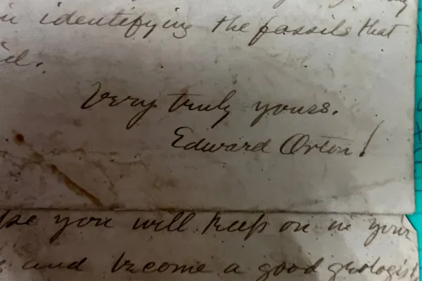 An old piece of paper has cursive that says "Very truly yours, Edward Orton"