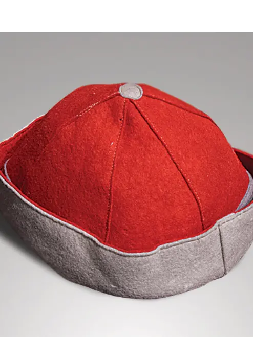 A red hat with a gray upturned brim. 