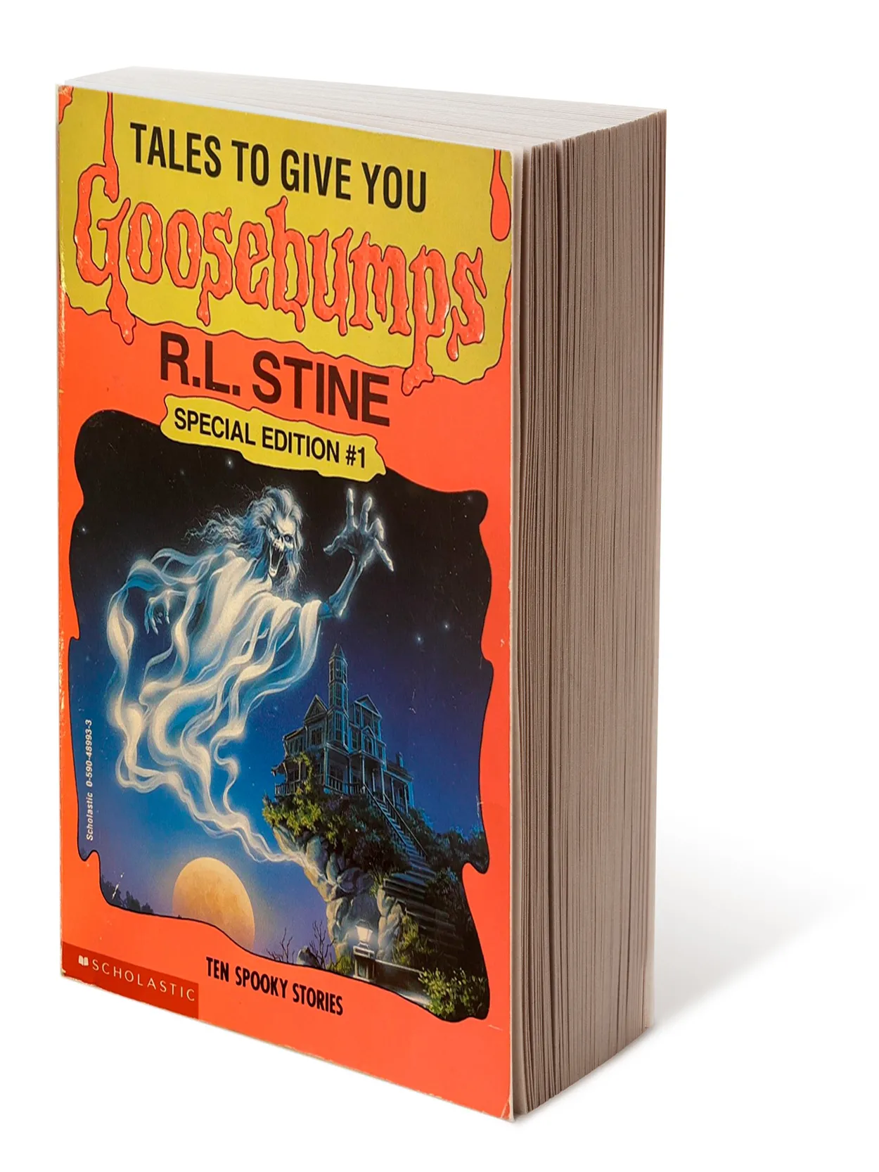 An old paperback book says: Tales to give you goosebumps, R.L. Stine, Special Edition number 1. It shows a ghostly spirit rising in front of a castle on a cliff and a full moon.