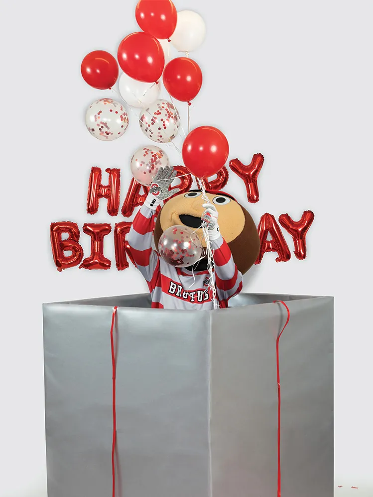 Brutus Buckeye plays with balloons