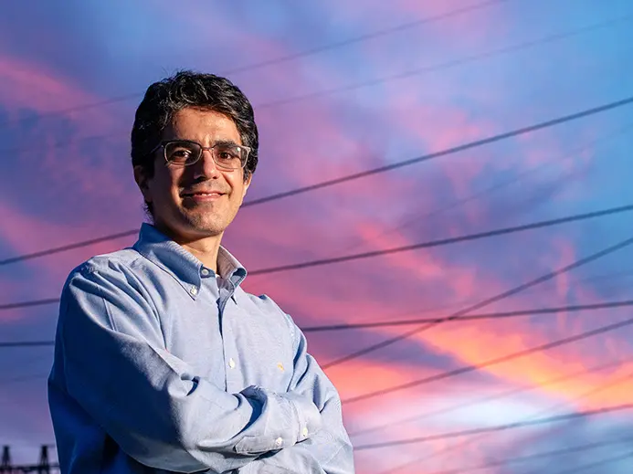 abdollah shafleezadeh standing in front of power lines