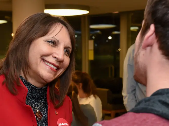 Bernadette Mazurek Melnyk is speaking to a young man